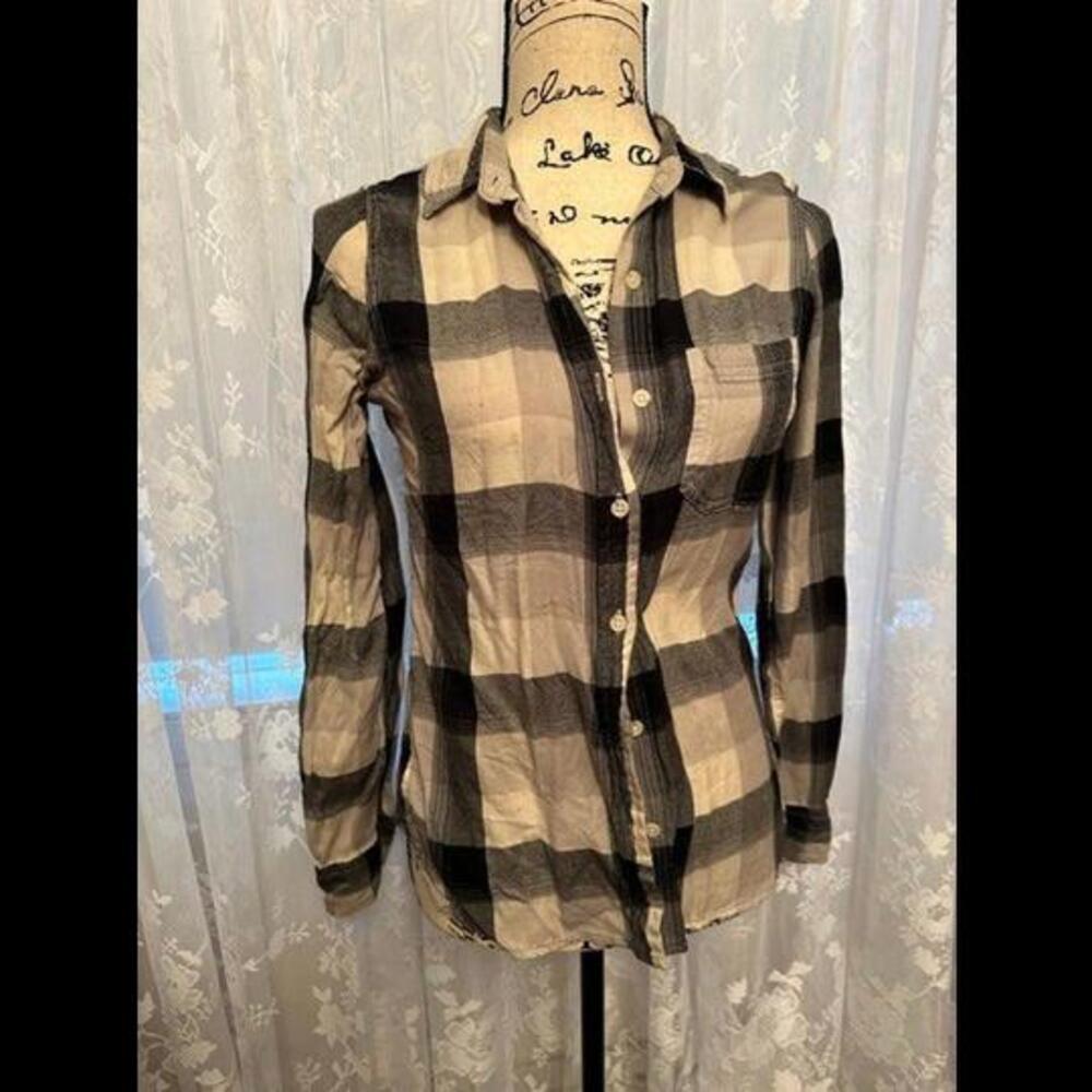 Elevate Your Style with this Classic Black and White Plaid Flannel Shirt!